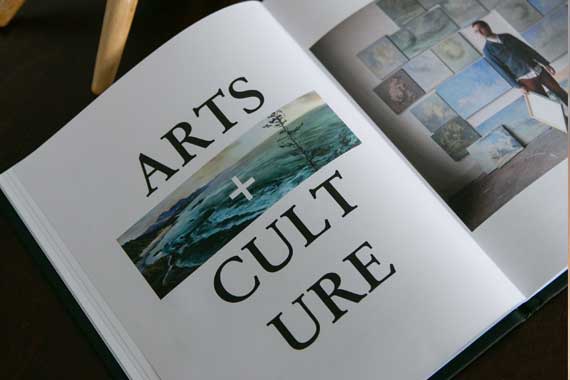 Open magazine spread displaying the ARTS + CULTURE header with photo strip accents beneath it.